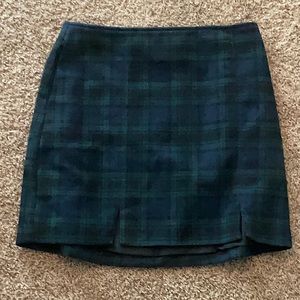 A mini plaid green, blue and black skirt.